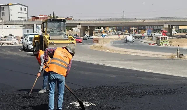 Büyükşehir'in asfalt çalışması esnafın yüzünü güldürdü